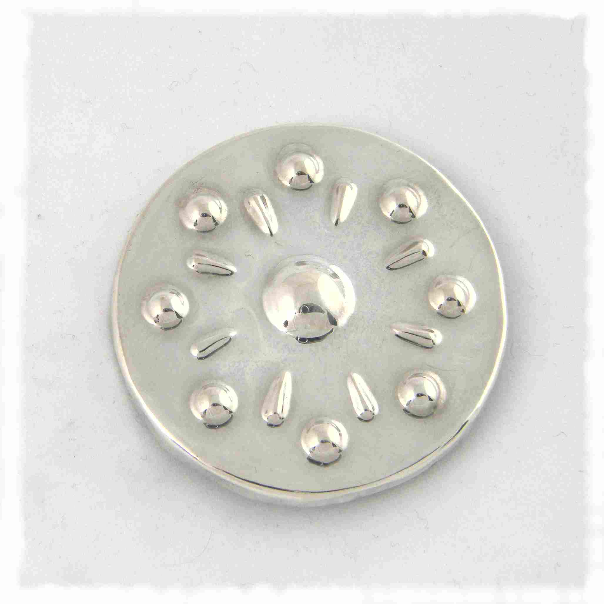 Silve symbolic sun brooch